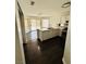 Cozy kitchen with ample counter space, white cabinets, stainless steel appliances, and sliding doors at 5711 Roundrock Dr, Las Vegas, NV 89142