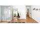 Bright and airy bedroom featuring wood floors, closet, and a full length mirror at 5929 Royal Castle Ln, Las Vegas, NV 89130