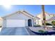 Charming single-story home with a two-car garage and low maintenance landscaping at 5929 Royal Castle Ln, Las Vegas, NV 89130