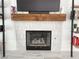 Living room fireplace features a sleek design with a wooden mantle and tiled surround at 5929 Royal Castle Ln, Las Vegas, NV 89130