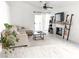 Bright living room with a comfortable sectional sofa, modern fireplace, and sliding glass doors to the patio at 5929 Royal Castle Ln, Las Vegas, NV 89130