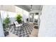 Covered outdoor patio features a patio set and mature landscaping at 5929 Royal Castle Ln, Las Vegas, NV 89130