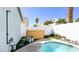 Relaxing backyard featuring a pool with an outdoor shower and landscaping at 5929 Royal Castle Ln, Las Vegas, NV 89130