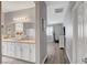 Bathroom with double sinks, granite counters, and modern lighting fixtures leading into another room at 5957 Olivine Falls Ave, Las Vegas, NV 89130