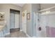 Bathroom showcasing a glass shower, and vanity with granite countertops at 5957 Olivine Falls Ave, Las Vegas, NV 89130