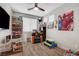 Bedroom with ceiling fan, wood floors, and shelving unit at 5957 Olivine Falls Ave, Las Vegas, NV 89130