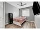 Bedroom with wood floors, ceiling fan, security safe and closet at 5957 Olivine Falls Ave, Las Vegas, NV 89130