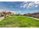 Spacious community green space with walking paths, benches, and a central picnic pavilion at 5957 Olivine Falls Ave, Las Vegas, NV 89130