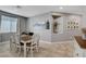 Well-lit dining room featuring a dining table and chairs with art accents and a built-in alcove for decor at 5957 Olivine Falls Ave, Las Vegas, NV 89130