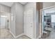 Hallway leading to bathroom with granite countertops and shower at 5957 Olivine Falls Ave, Las Vegas, NV 89130