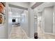 Open hallway leading to living spaces and a bathroom, with tile floors at 5957 Olivine Falls Ave, Las Vegas, NV 89130