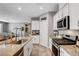 Modern kitchen with granite counters, stainless steel appliances, and a spacious island perfect for cooking at 5957 Olivine Falls Ave, Las Vegas, NV 89130