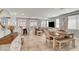Spacious living room and dining area with tile floors and ample natural light at 5957 Olivine Falls Ave, Las Vegas, NV 89130