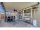 Covered patio with dining set, ceiling fan, and outdoor heater, perfect for entertaining at 5957 Olivine Falls Ave, Las Vegas, NV 89130