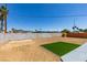 Large backyard featuring a partial block wall and some turf at 6100 Fawn Cir, Las Vegas, NV 89107