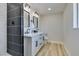 Modern bathroom with a double vanity, updated fixtures, and a tiled shower at 6100 Fawn Cir, Las Vegas, NV 89107
