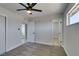 This bedroom features carpeting and a ceiling fan and provides entry to other rooms at 6100 Fawn Cir, Las Vegas, NV 89107