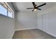 This is a standard carpeted bedroom that features a ceiling fan and a closet at 6100 Fawn Cir, Las Vegas, NV 89107
