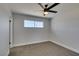 Bedroom with a ceiling fan, carpeted floors, and a window at 6100 Fawn Cir, Las Vegas, NV 89107