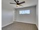 Clean bedroom featuring a ceiling fan, carpet, and a window at 6100 Fawn Cir, Las Vegas, NV 89107