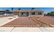 Front exterior of a single story home with desert landscaping at 6100 Fawn Cir, Las Vegas, NV 89107