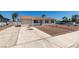 Single-story home with a gravel yard and concrete driveway at 6100 Fawn Cir, Las Vegas, NV 89107