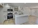 Modern kitchen with stainless steel appliances, quartz countertops, and a functional island at 6100 Fawn Cir, Las Vegas, NV 89107