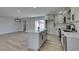 A bright kitchen featuring an island, white cabinets, and stainless steel appliances at 6100 Fawn Cir, Las Vegas, NV 89107