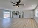Bright open-concept living area featuring modern flooring and access to the kitchen with a center island at 6100 Fawn Cir, Las Vegas, NV 89107