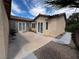 An enclosed backyard with desert landscaping and a covered patio, ideal for relaxation at 6134 Burleson Ranch Rd, Las Vegas, NV 89131