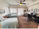 Spacious bedroom featuring two twin beds, neutral carpet, and comfortable seating area at 6134 Burleson Ranch Rd, Las Vegas, NV 89131
