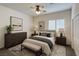 Bedroom featuring a queen bed with a ceiling fan and lots of light at 6134 Burleson Ranch Rd, Las Vegas, NV 89131