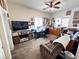 Cozy bedroom with ceiling fan, window shutters, and organized furniture sets at 6134 Burleson Ranch Rd, Las Vegas, NV 89131