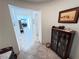 Inviting hallway with tile floors, neutral walls, and decorative furnishings at 6134 Burleson Ranch Rd, Las Vegas, NV 89131