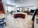 Open concept kitchen with granite counters, a large island, and views into the living room at 6134 Burleson Ranch Rd, Las Vegas, NV 89131