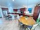 Gourmet kitchen with granite counters, stainless appliances, island with bar seating, and adjacent breakfast nook at 6134 Burleson Ranch Rd, Las Vegas, NV 89131