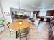 Open-concept kitchen and dining area with stainless steel appliances and a kitchen island at 6134 Burleson Ranch Rd, Las Vegas, NV 89131