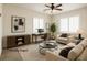 Comfortable living area with neutral tones and a ceiling fan at 6134 Burleson Ranch Rd, Las Vegas, NV 89131