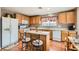 Functional kitchen with an island, adjacent to a cozy dining area at 6390 Whispering Clouds Ct, Las Vegas, NV 89141
