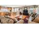 Inviting living room with hardwood floors and an open floor plan to the kitchen at 6390 Whispering Clouds Ct, Las Vegas, NV 89141