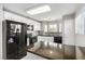 Bright kitchen with white cabinets, black appliances, and granite counter tops at 6428 Yarmouth Dr, Las Vegas, NV 89108