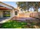 Charming backyard with a well maintained brick patio and healthy green grass at 684 Whispering Palms Dr, Las Vegas, NV 89123