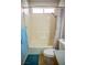 Bathroom with white tub, tiled shower, toilet, and window at 684 Whispering Palms Dr, Las Vegas, NV 89123