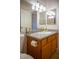 Bathroom with cabinets, counter, sink, and lighting at 684 Whispering Palms Dr, Las Vegas, NV 89123