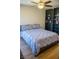 Bedroom with a ceiling fan, wood floor, and closet at 684 Whispering Palms Dr, Las Vegas, NV 89123