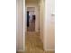 Hallway with patterned tile flooring with multiple doorways at 684 Whispering Palms Dr, Las Vegas, NV 89123