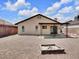 Spacious backyard featuring a covered patio and a charming fire pit, perfect for outdoor entertaining at 7268 Wichita Ct, Las Vegas, NV 89119