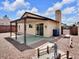 This home features a cozy covered patio and unique yard decor, ideal for relaxing and entertaining at 7268 Wichita Ct, Las Vegas, NV 89119