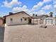 Expansive backyard featuring a shed, patio area, gravel landscaping, and open space at 7268 Wichita Ct, Las Vegas, NV 89119