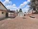 Spacious backyard with gravel landscaping, shed, patio, and potential for outdoor living at 7268 Wichita Ct, Las Vegas, NV 89119